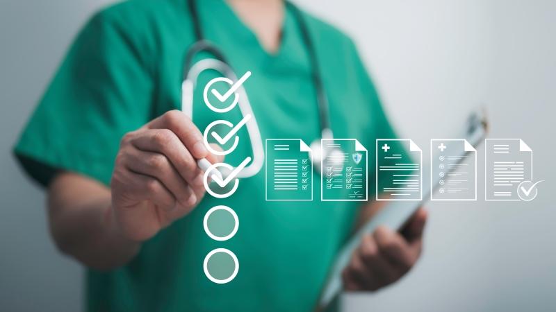 Doctor in scrubs with digital graphics